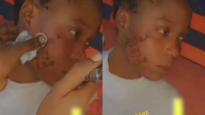 Reactions As Young Lady Tattoos Boyfriend's Name On Her Face (Video)